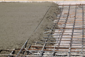 pouring concrete into prepared place with reinforced metal frame The prices of concrete reinforcing steel mesh